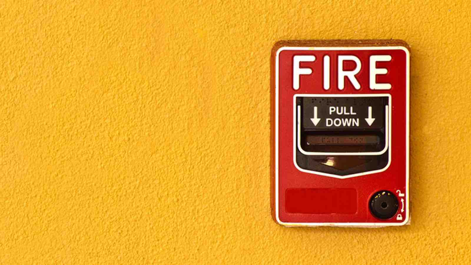 fireprevention_main Fire alarm on a yellow wall